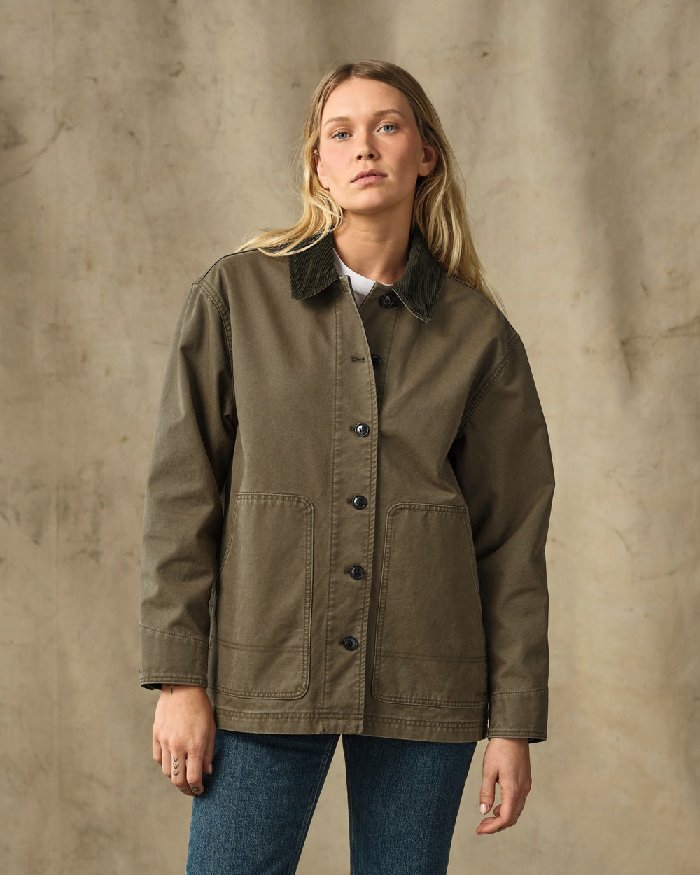 image of a model wearing Filson's Women's Canvas Barn Coat - Marsh Olive