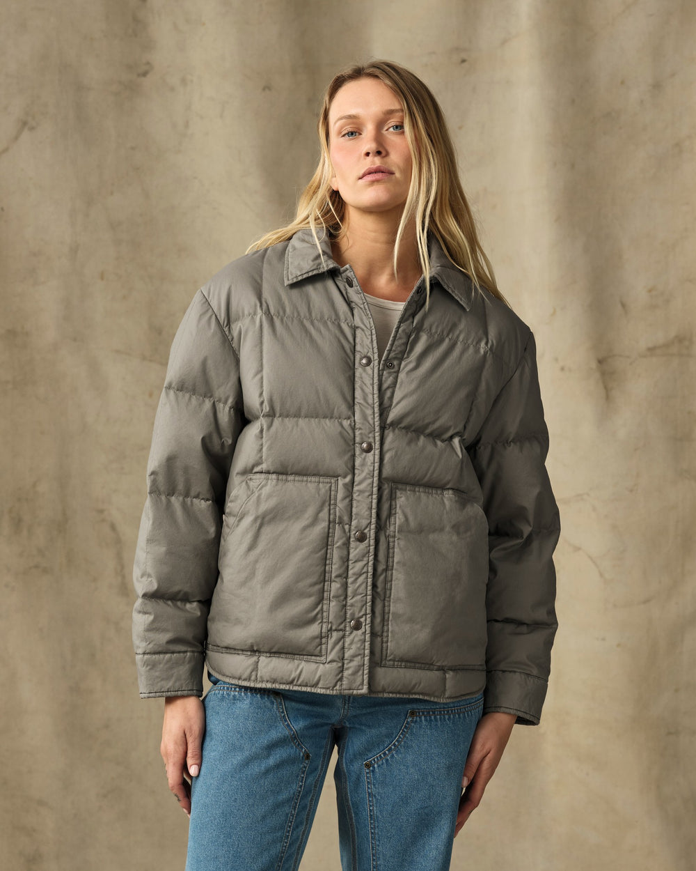 image of a model wearing Filson's Women's Heritage Cotton Down Jacket - Smokey Olive