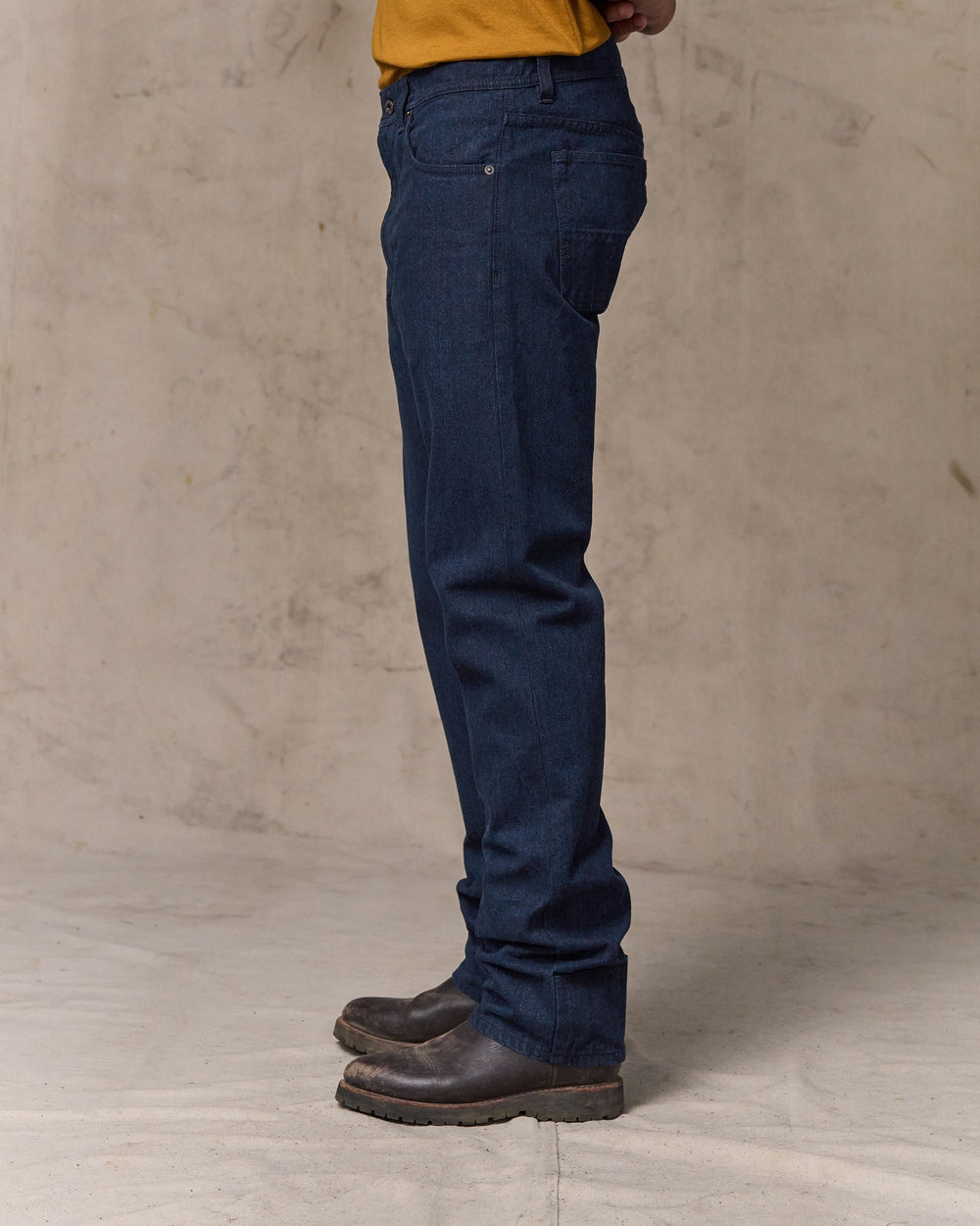image of a model wearing Filson's Dry Tin Cloth 5-pocket Pants - Indigo