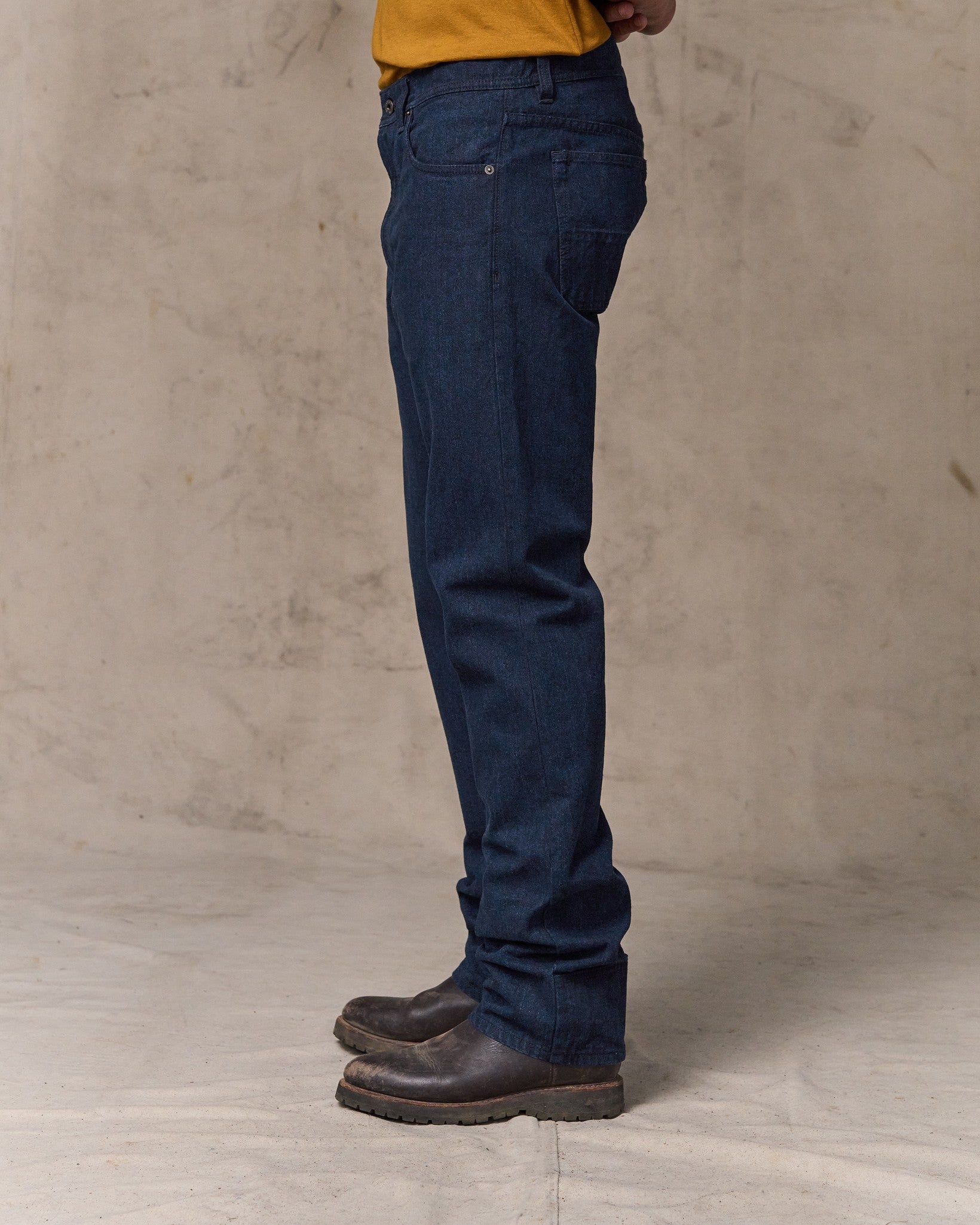 image of a model wearing Filson's Dry Tin Cloth 5-pocket Pants - Indigo