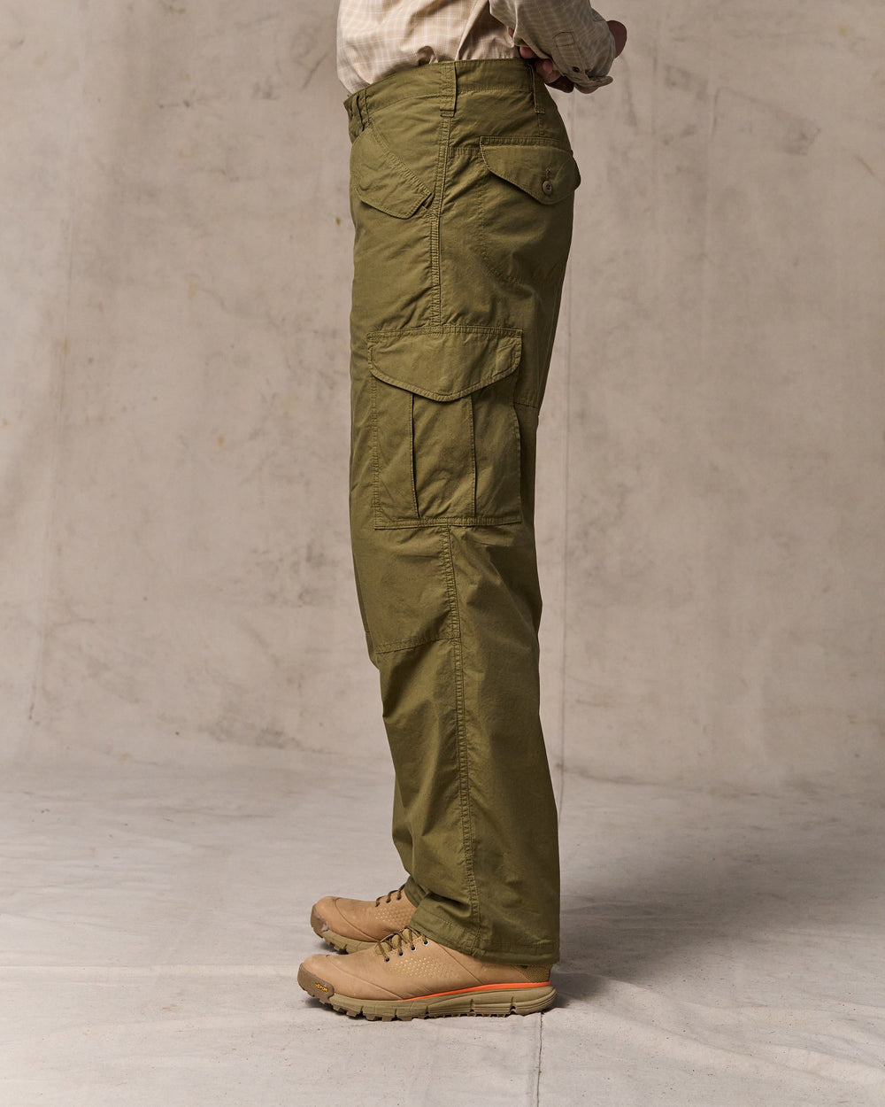image of a model wearing Filson's Tropical Poplin Cargo Pants - Military Olive