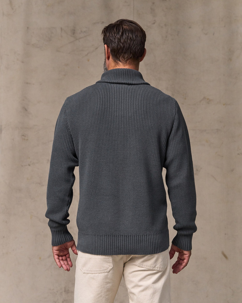 image of a model wearing Filson's Vintage Cotton Shawl Neck Sweater - Charcoal