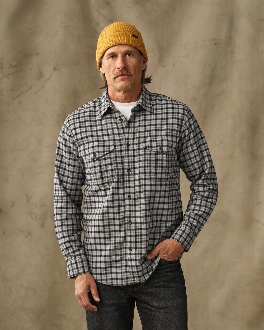 image of a model wearing Filson's Lightweight Alaskan Guide Shirt - Light Charcoal Plaid