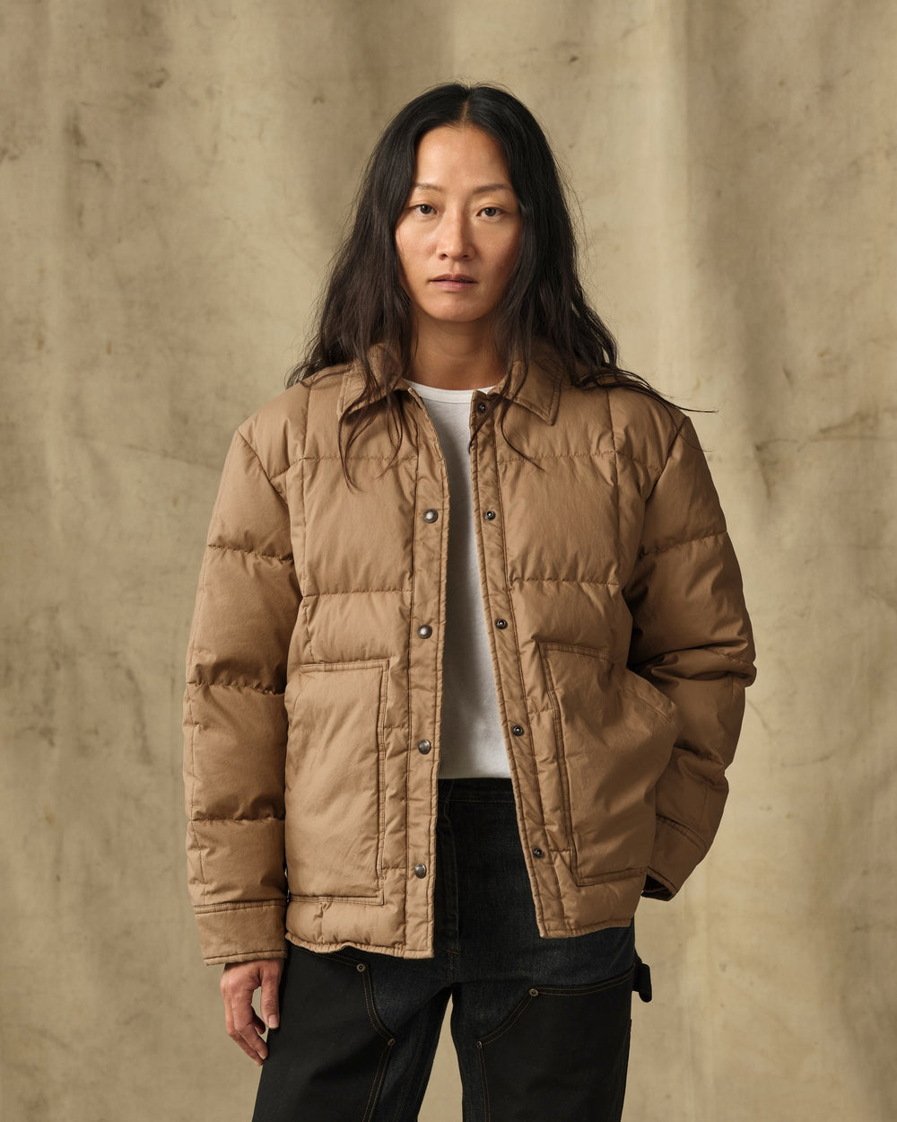 image of a model wearing Filson's Women's Heritage Cotton Down Jacket - Antique Bronze