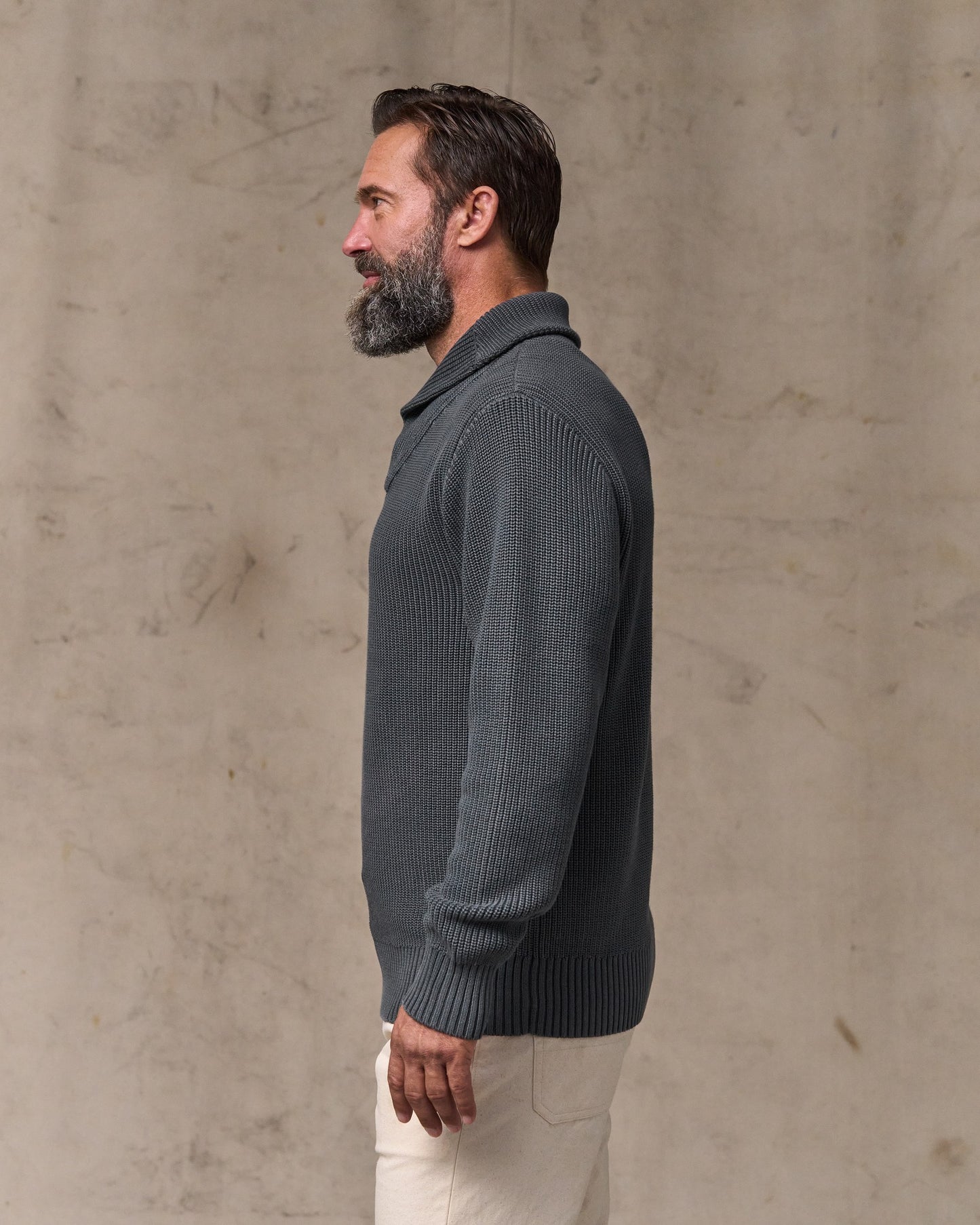 image of a model wearing Filson's Vintage Cotton Shawl Neck Sweater - Charcoal