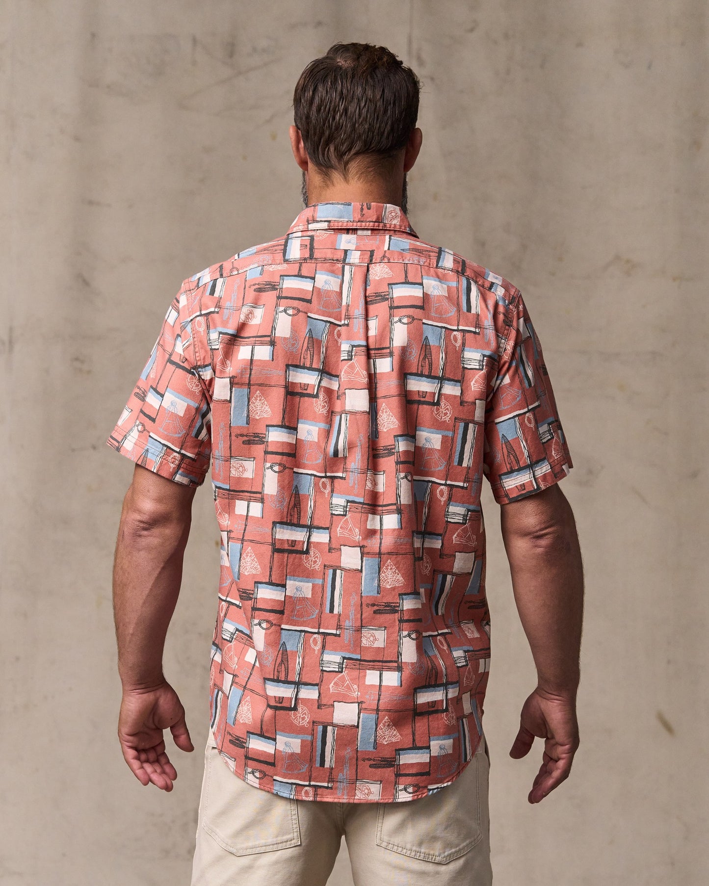 image of a model wearing Filson's Short Sleeve Lightweight Alaskan Guide Shirt  - Russet / Print