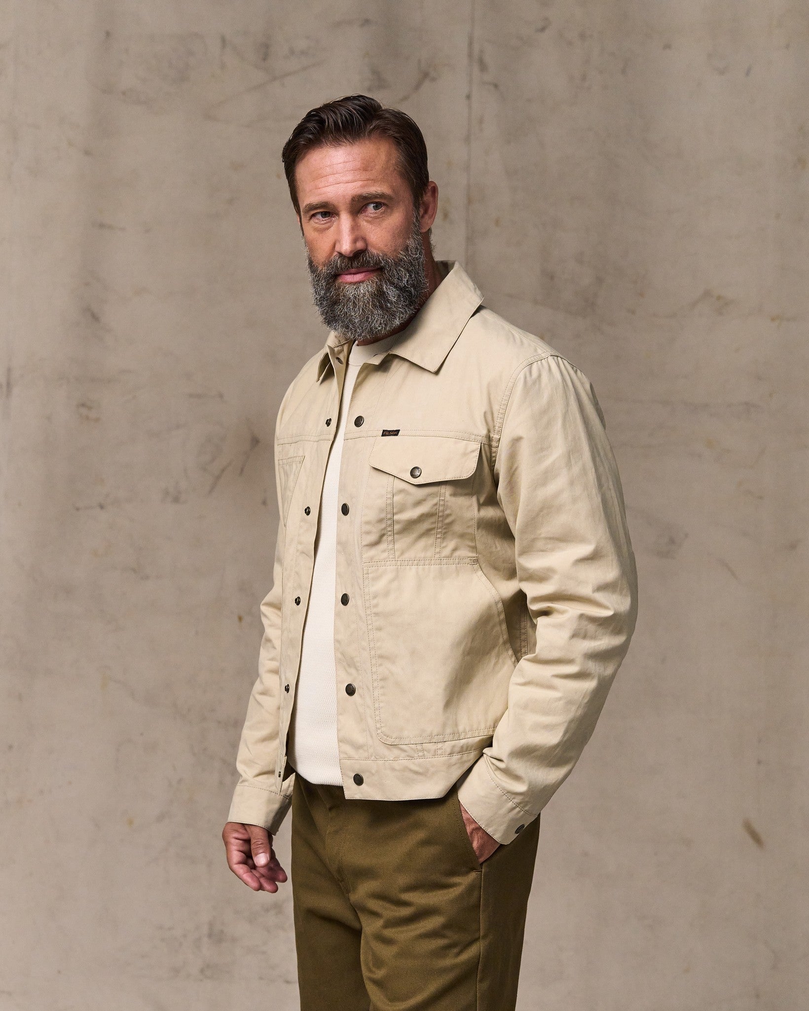 image of a model wearing Filson's Dry Wax Short Cruiser Jacket - Quail Tan