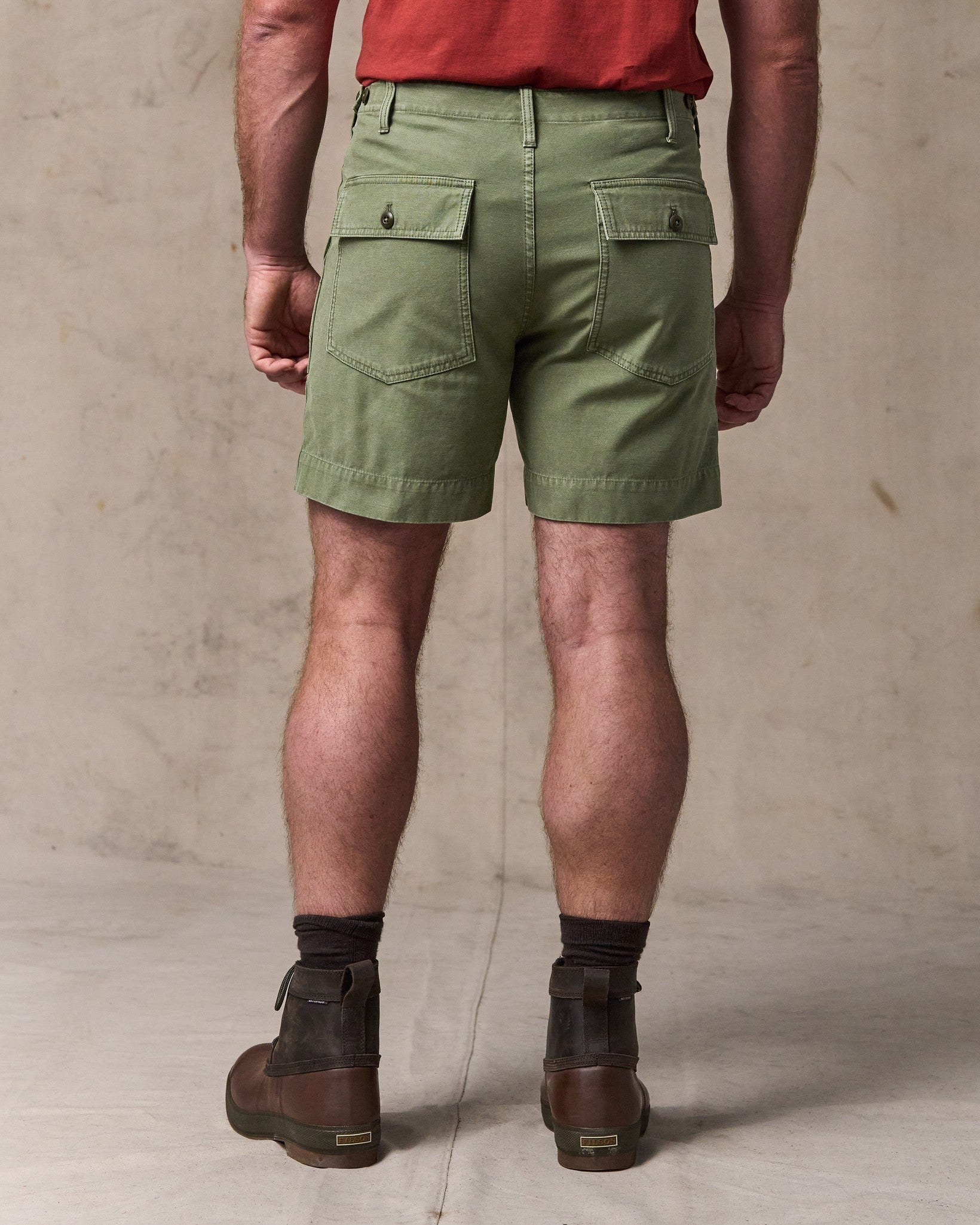 image of a model wearing Filson's Field Supply Shorts - Washed Fatigue Green