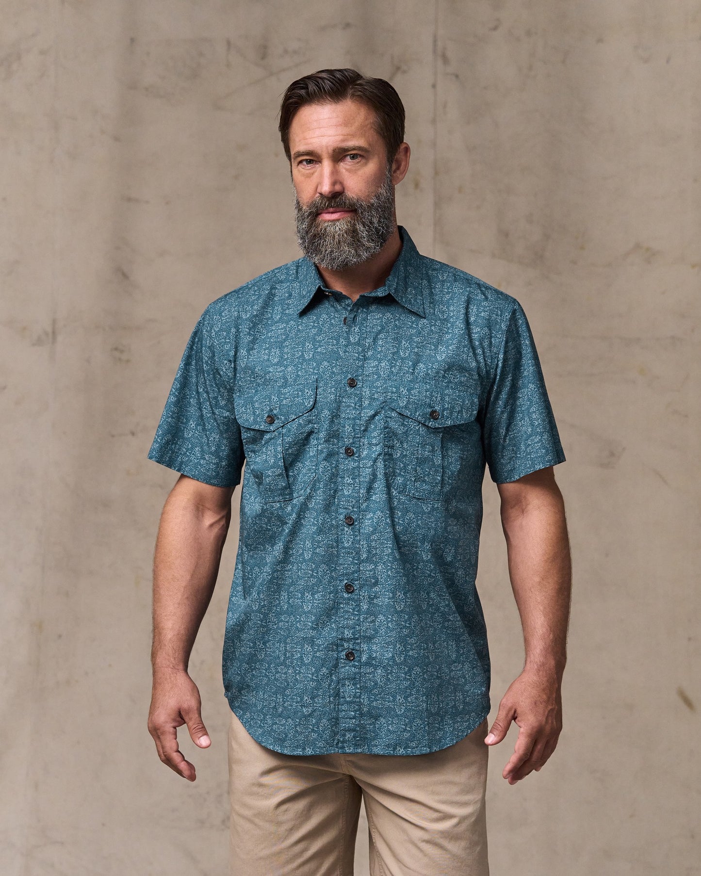 image of a model wearing Filson's Filson's Washed Short Sleeve Feather Cloth Shirt - Blue / Print|Model is 6'1" wearing a size medium