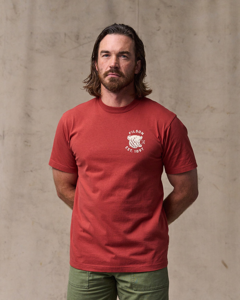 image of a model wearing Filson's Bear Graphic T-shirt - Chili Oil