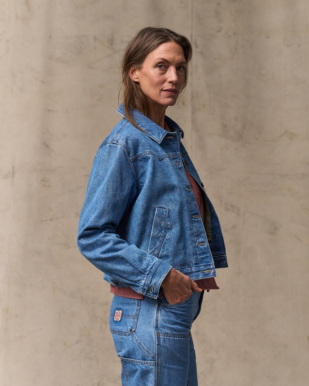 image of a model wearing Filson's Women's Western Denim Jacket - Light Indigo