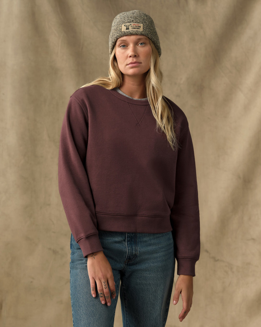 image of a model wearing Filson's Women's French Terry Crewneck - Eagle Brown