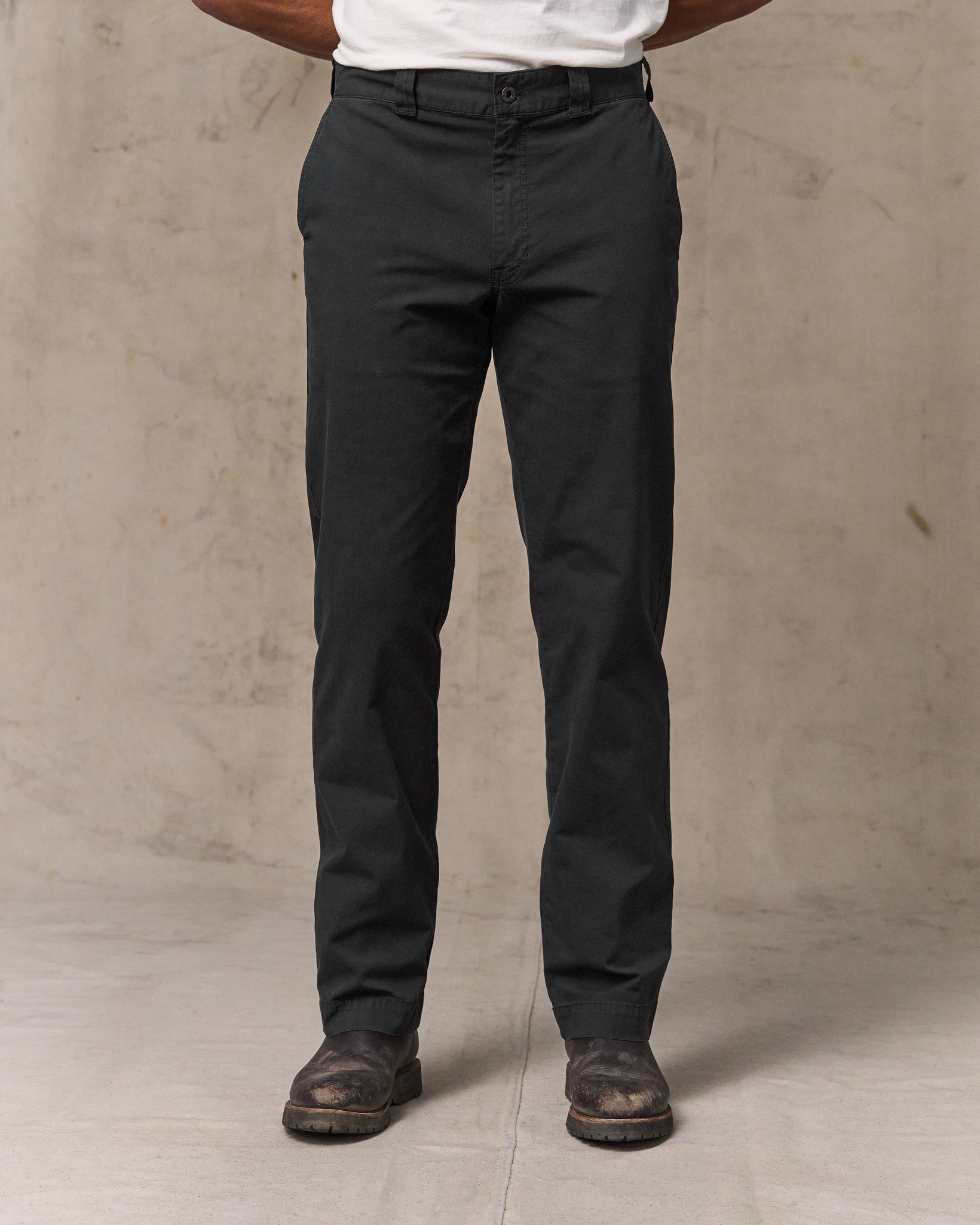 image of a model wearing Filson's Granite Mountain Flat Front Pants - Washed Faded Black
