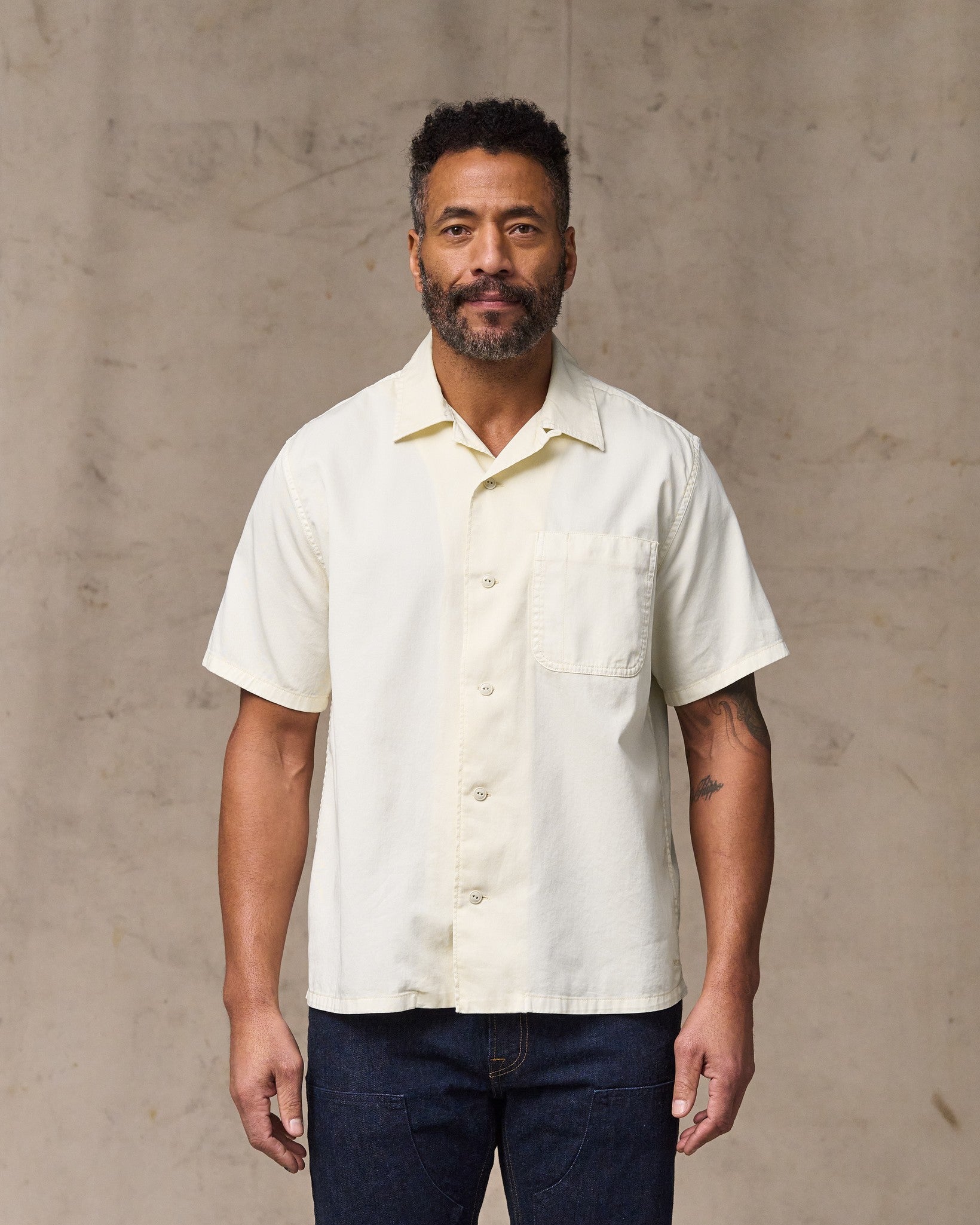 image of a model wearing Filson's Short Sleeve 4.5-oz. Twill Shirt - Ivory