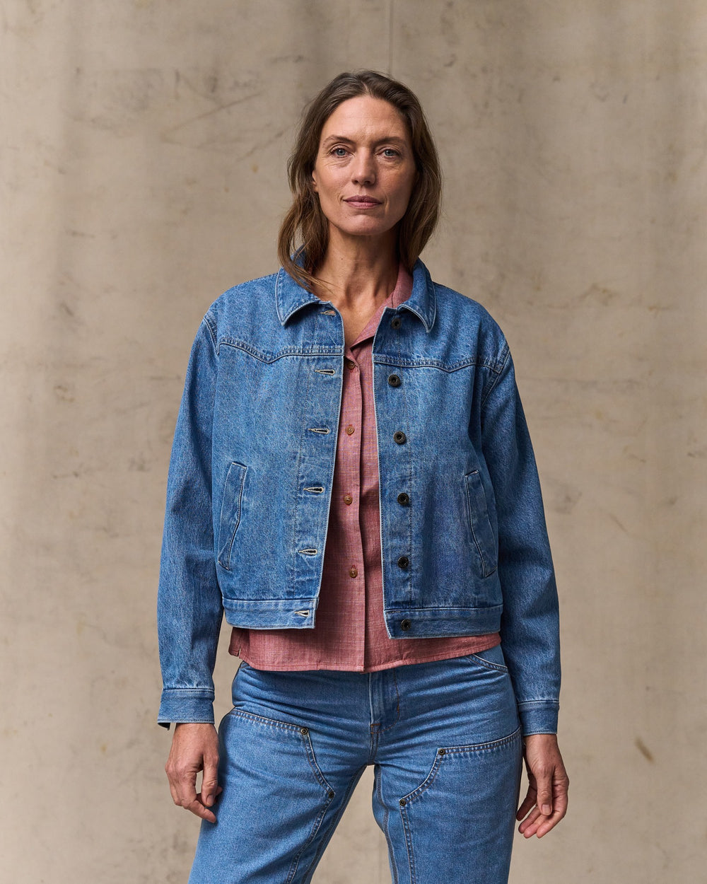 image of a model wearing Filson's Women's Western Denim Jacket - Light Indigo