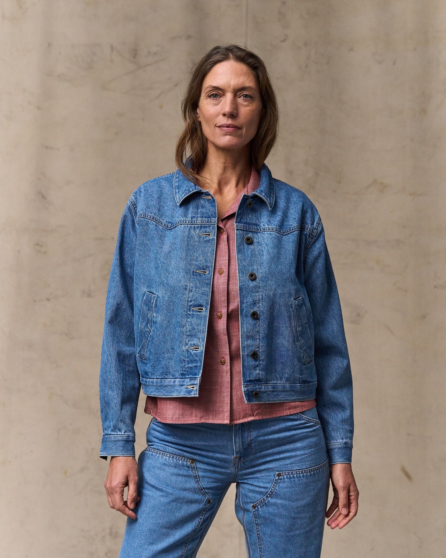 image of a model wearing Filson's Women's Western Denim Jacket - Light Indigo|Model is 5'10" wearing a size medium