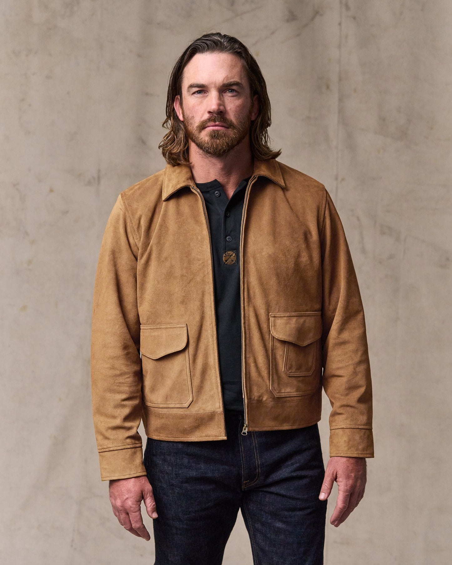 image of a model wearing Filson's Leather Hadlock Jacket - Saddle Brown|Model is 6'1" wearing a size medium