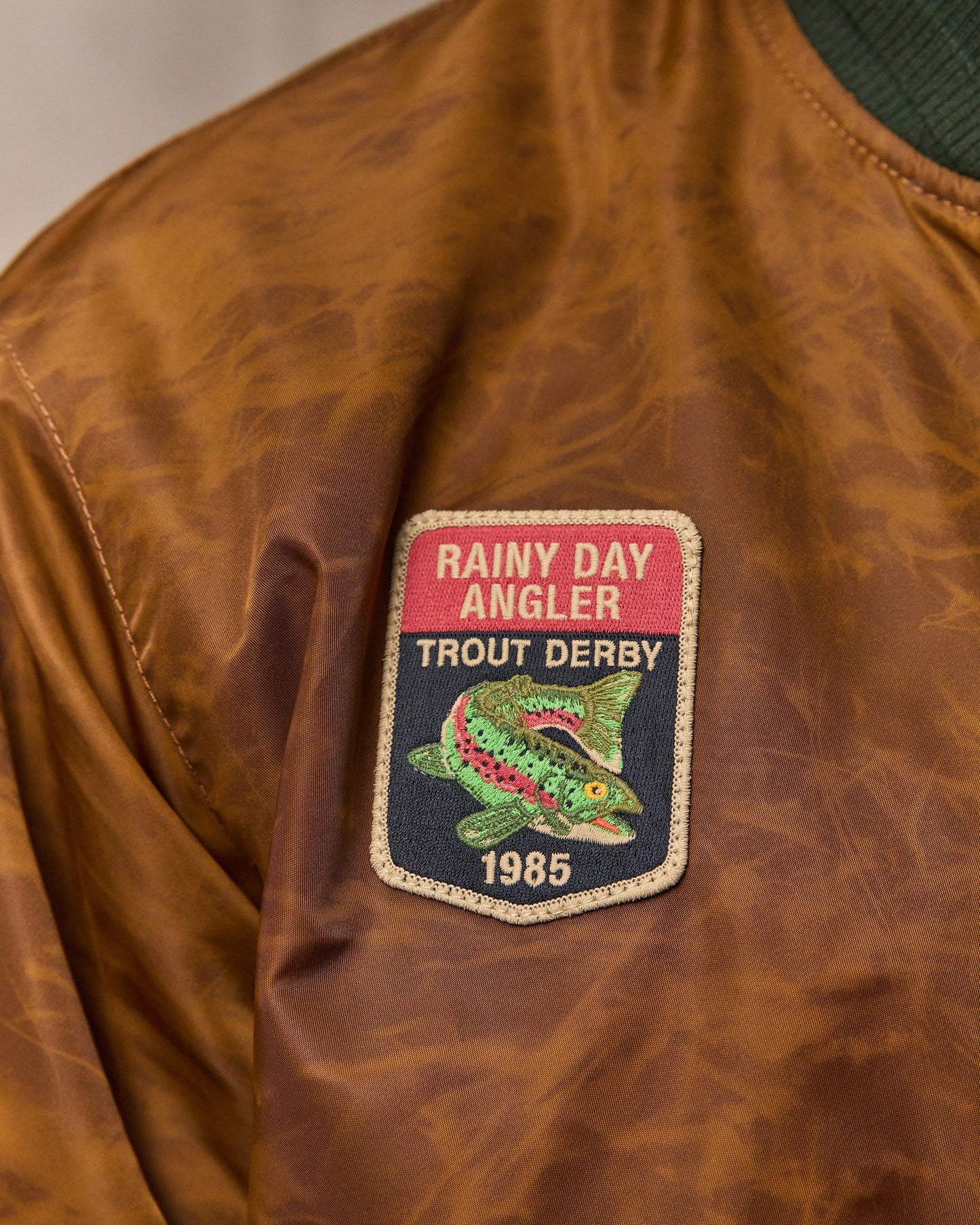 image of a model wearing Filson's Embroidered Montlake Jacket - Whiskey