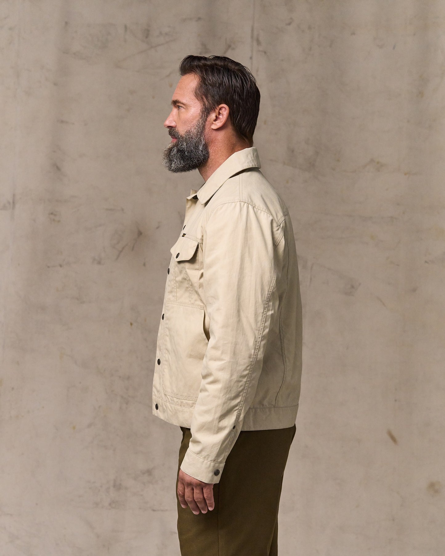 image of a model wearing Filson's Dry Wax Short Cruiser Jacket - Quail Tan
