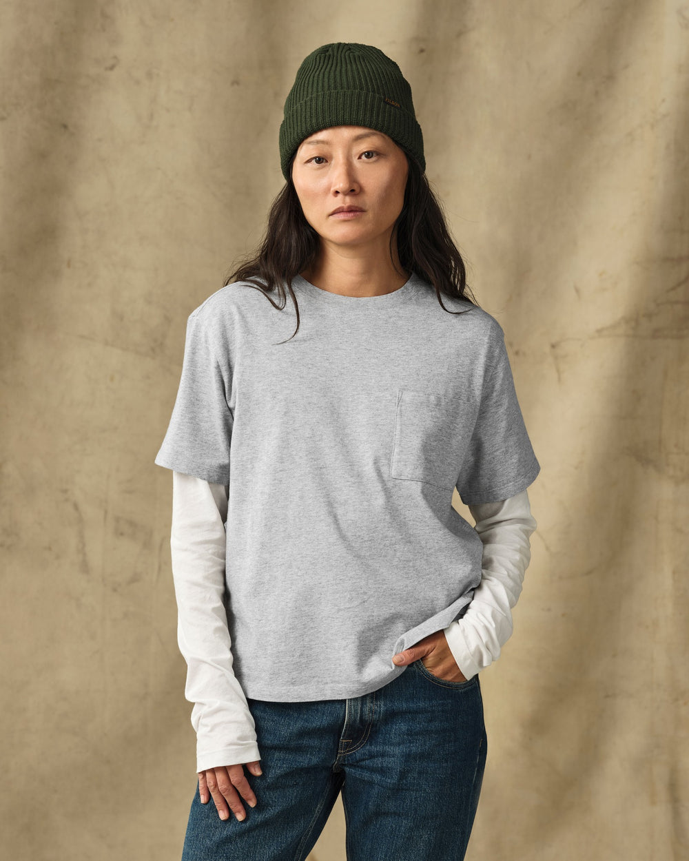 image of a model wearing Filson's Women's Short Sleeve Pocket Tee - Heather Gray