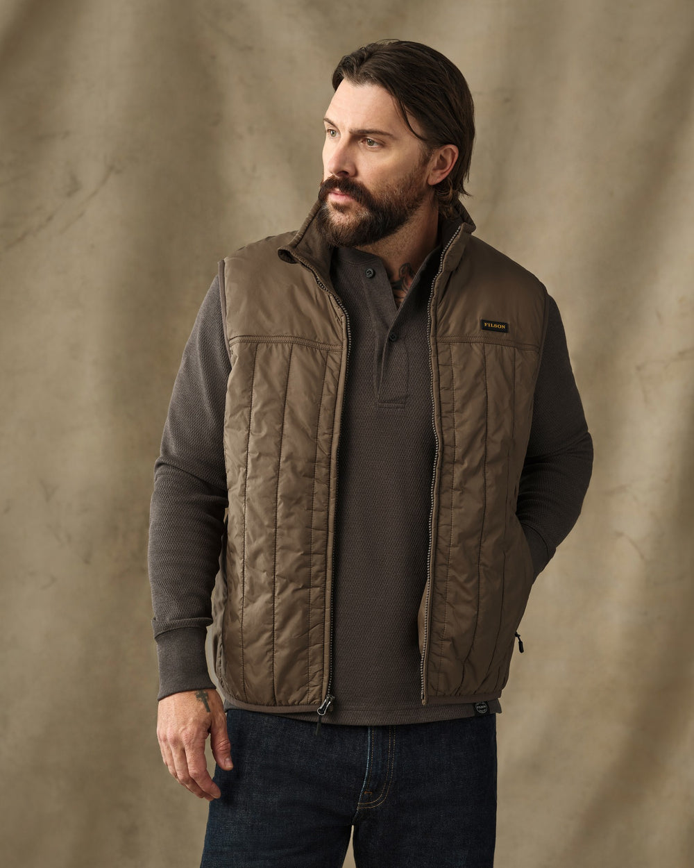 image of a model wearing Filson's Ultralight Vest - Teak