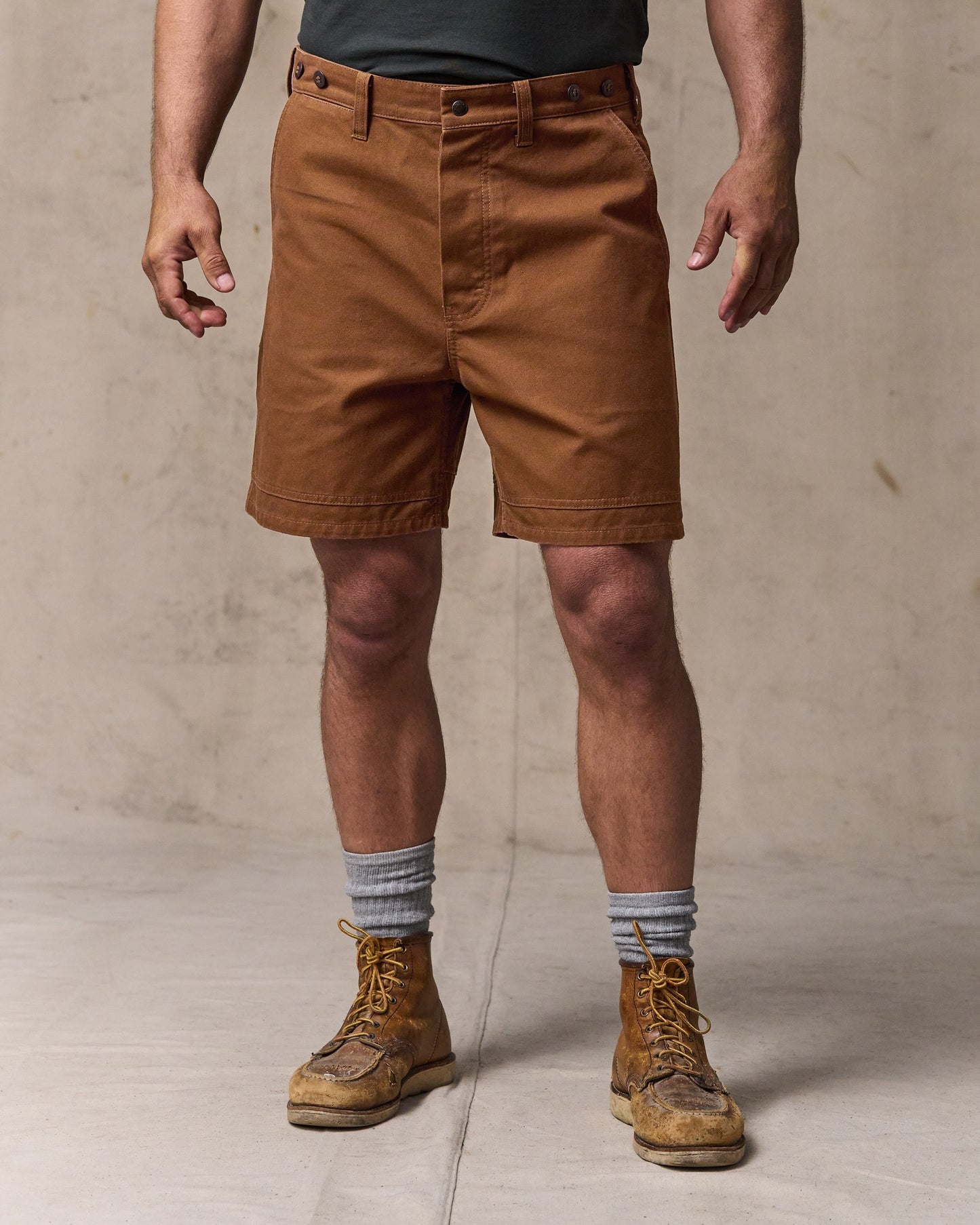 image of a model wearing Filson's Dry Tin Cloth Shorts - Whiskey|Model is 6'1" wearing a size 34”