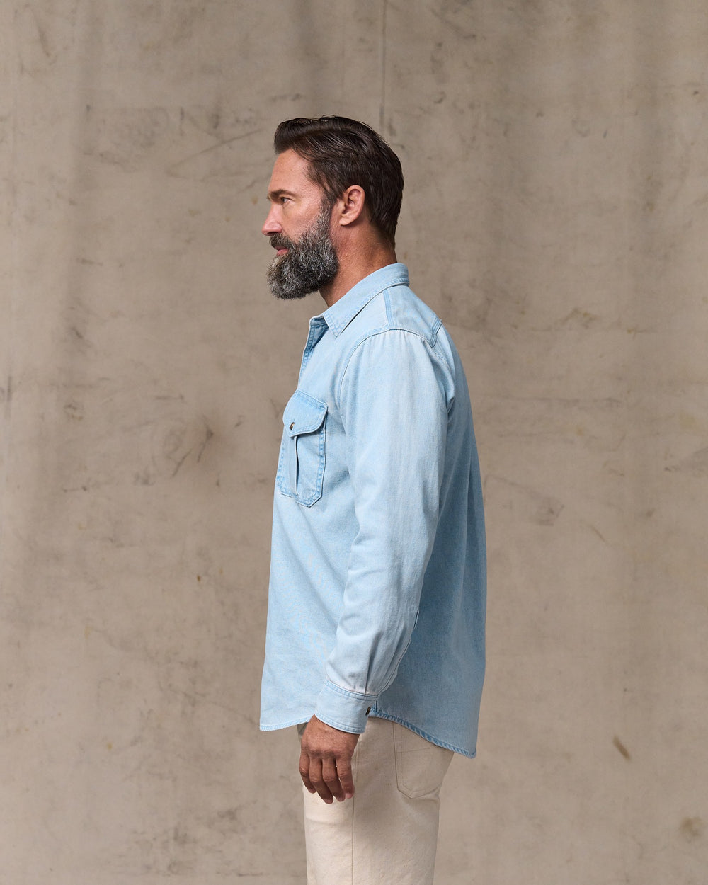 image of a model wearing Filson's Denim Guide Shirt - Light Indigo