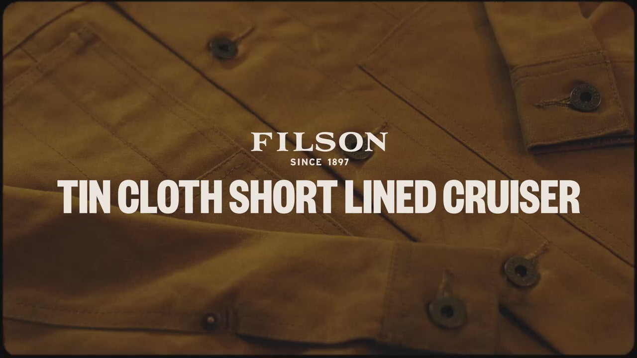 Load video: Filson employee describing the features of the Tin Cloth Short Lined Cruiser.